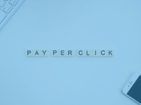 pay-per-click spelled out near a laptop and smartphone